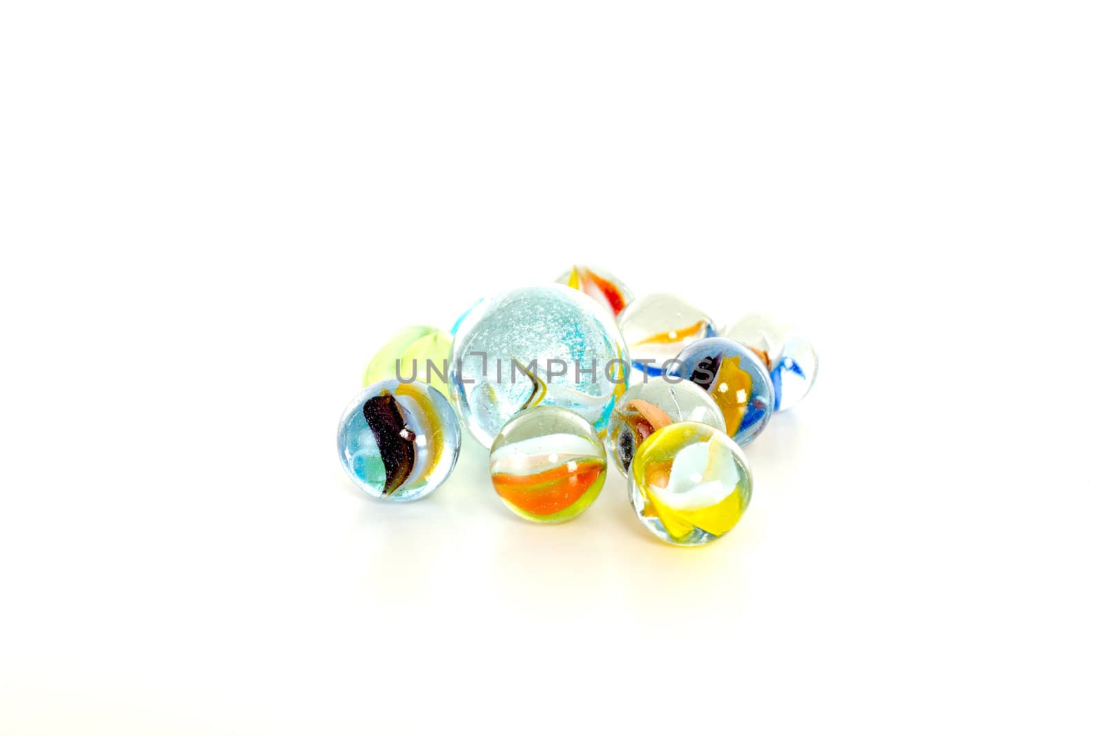 Colourful marbles on white background