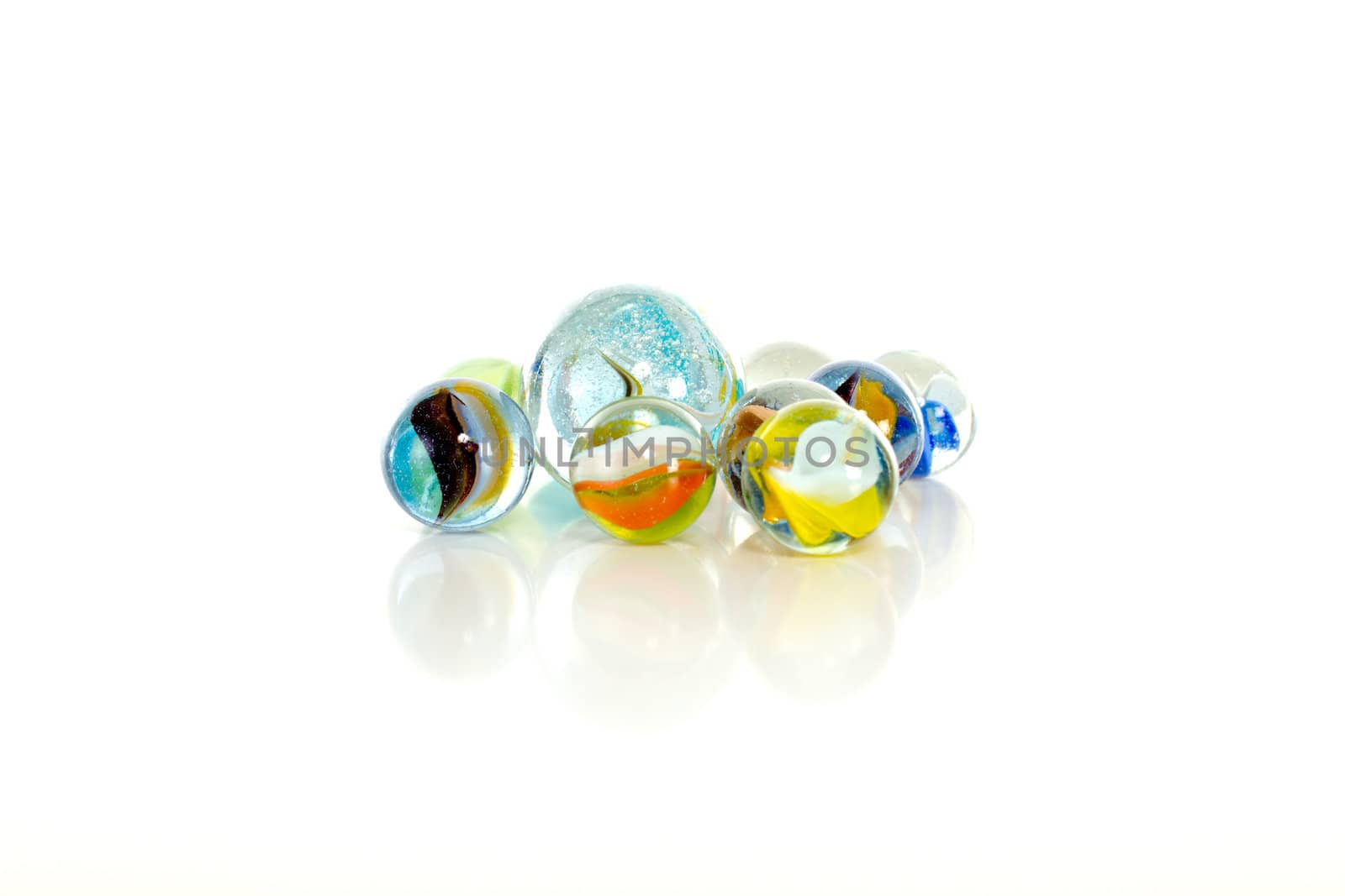 Colourful marbles on white background