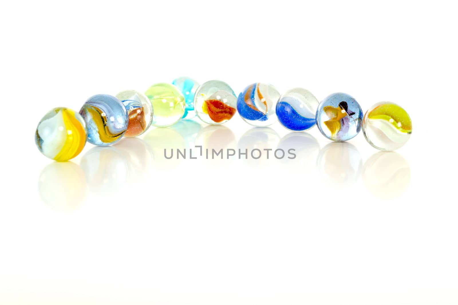 Colourful marbles on white background