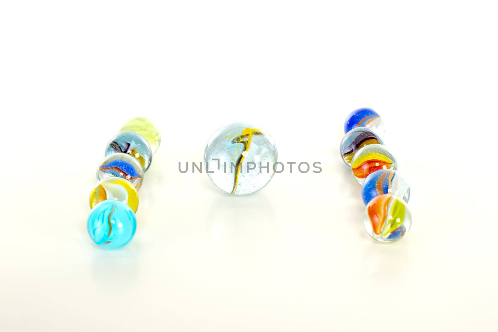 Colourful marbles on white background