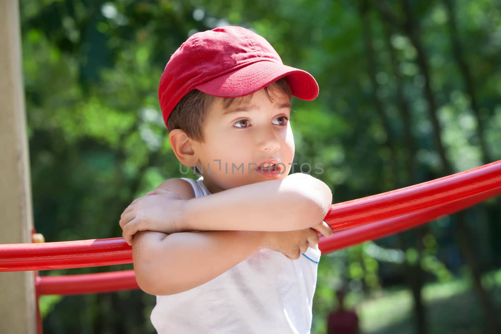 Portrait of a 3-4 years boy playing on the playground