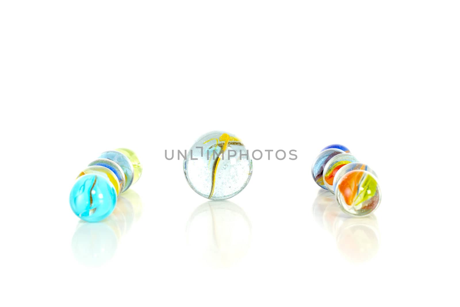 Colourful marbles on white background