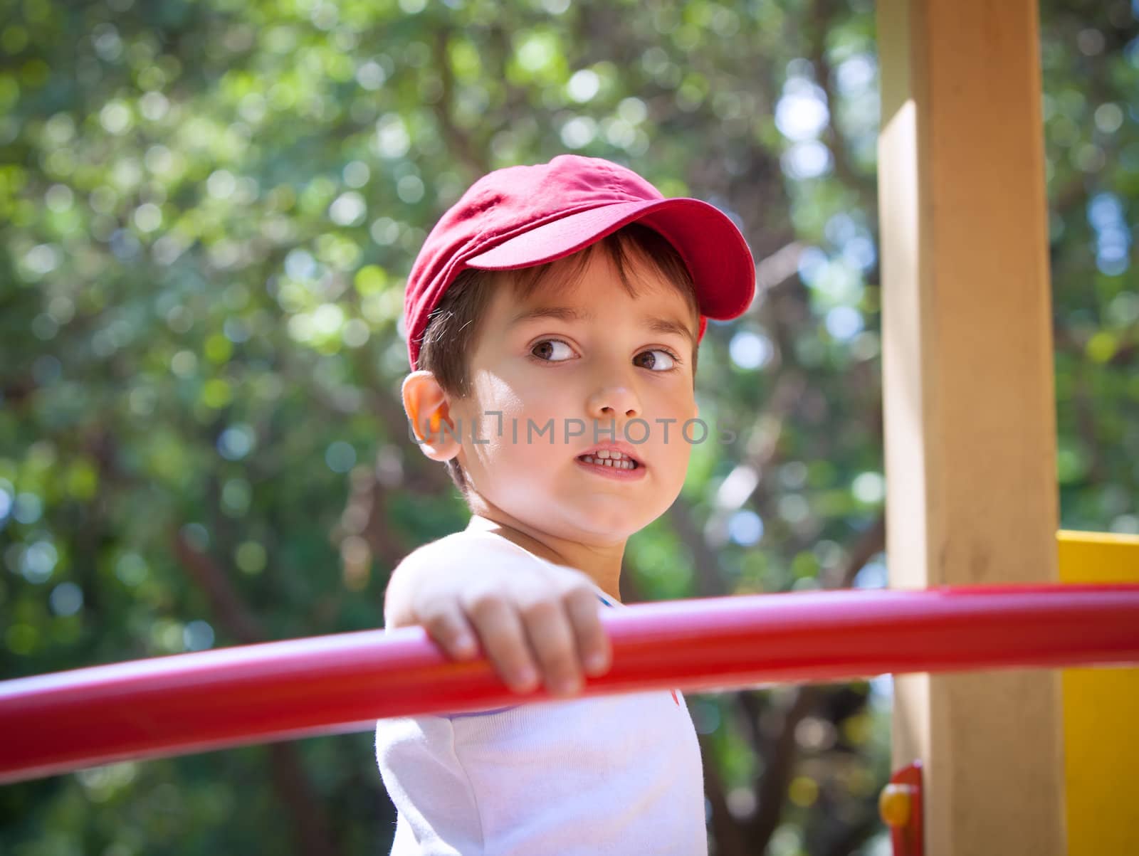 Portrait of a  3-4 years boy playing on the playground