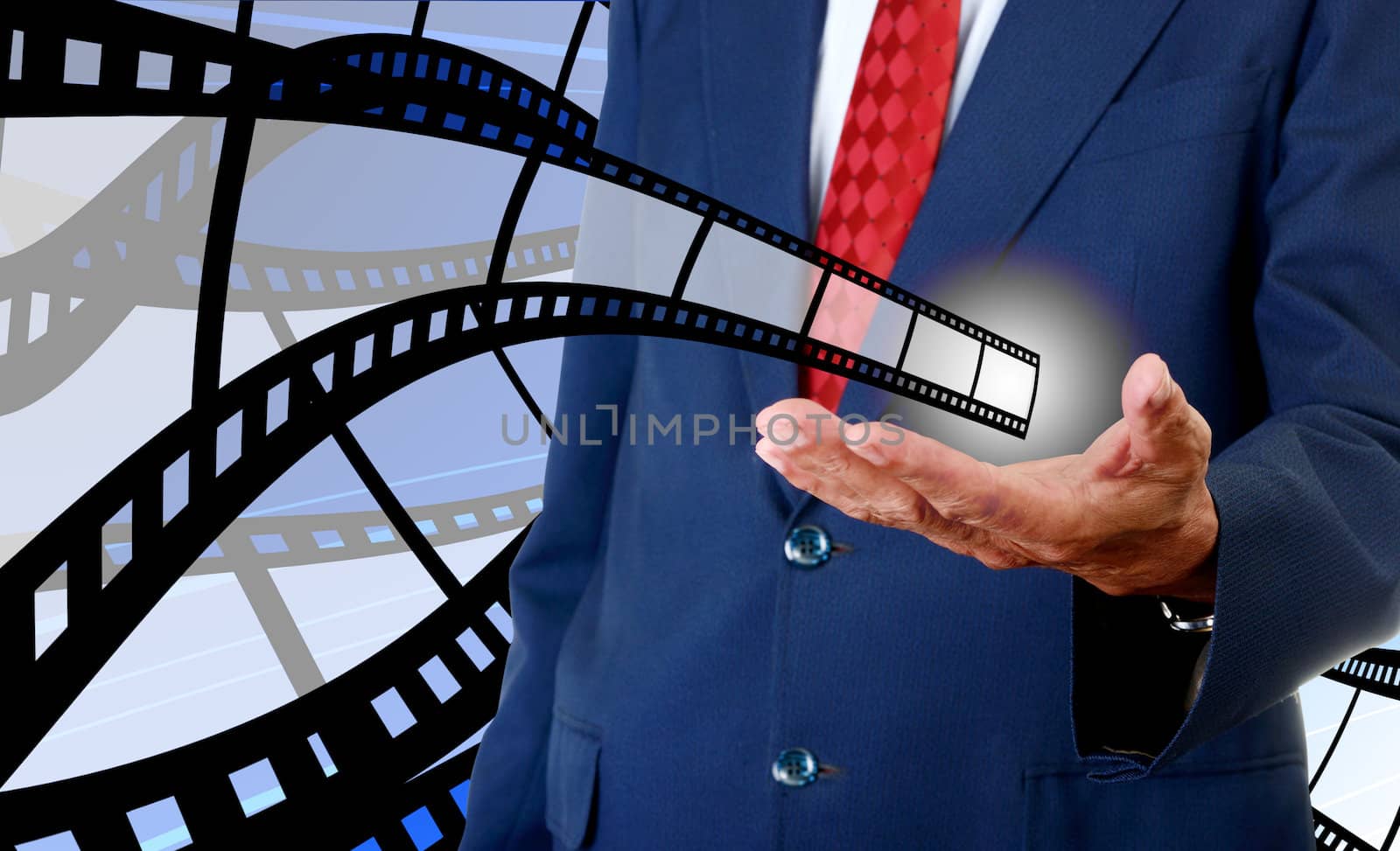 Film strip in businessman hand, Movie industrial