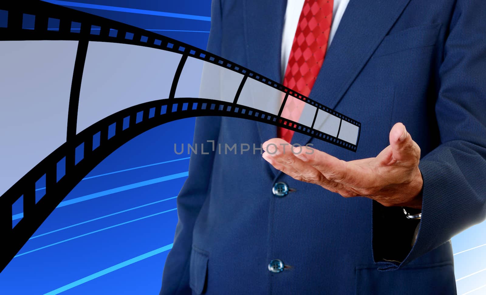 Film strip in businessman hand, Cinema industrial