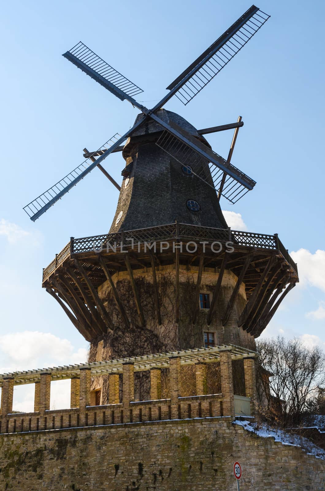 Old wood and stone historical wind mill in Potsdam, Germany
