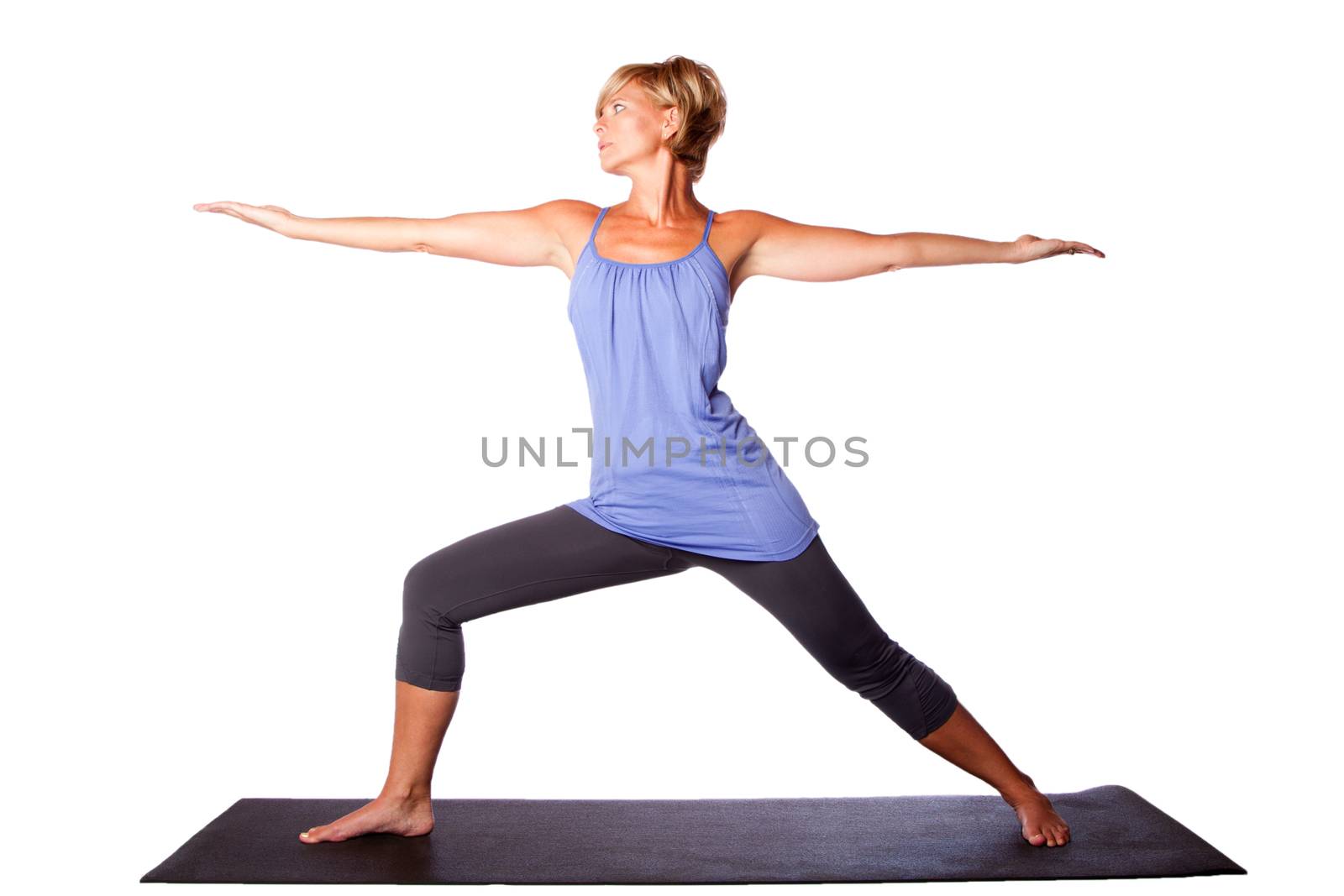 Warrior Two Virabhadrasana yoga pose extending arms by beautiful healthy woman, on white.