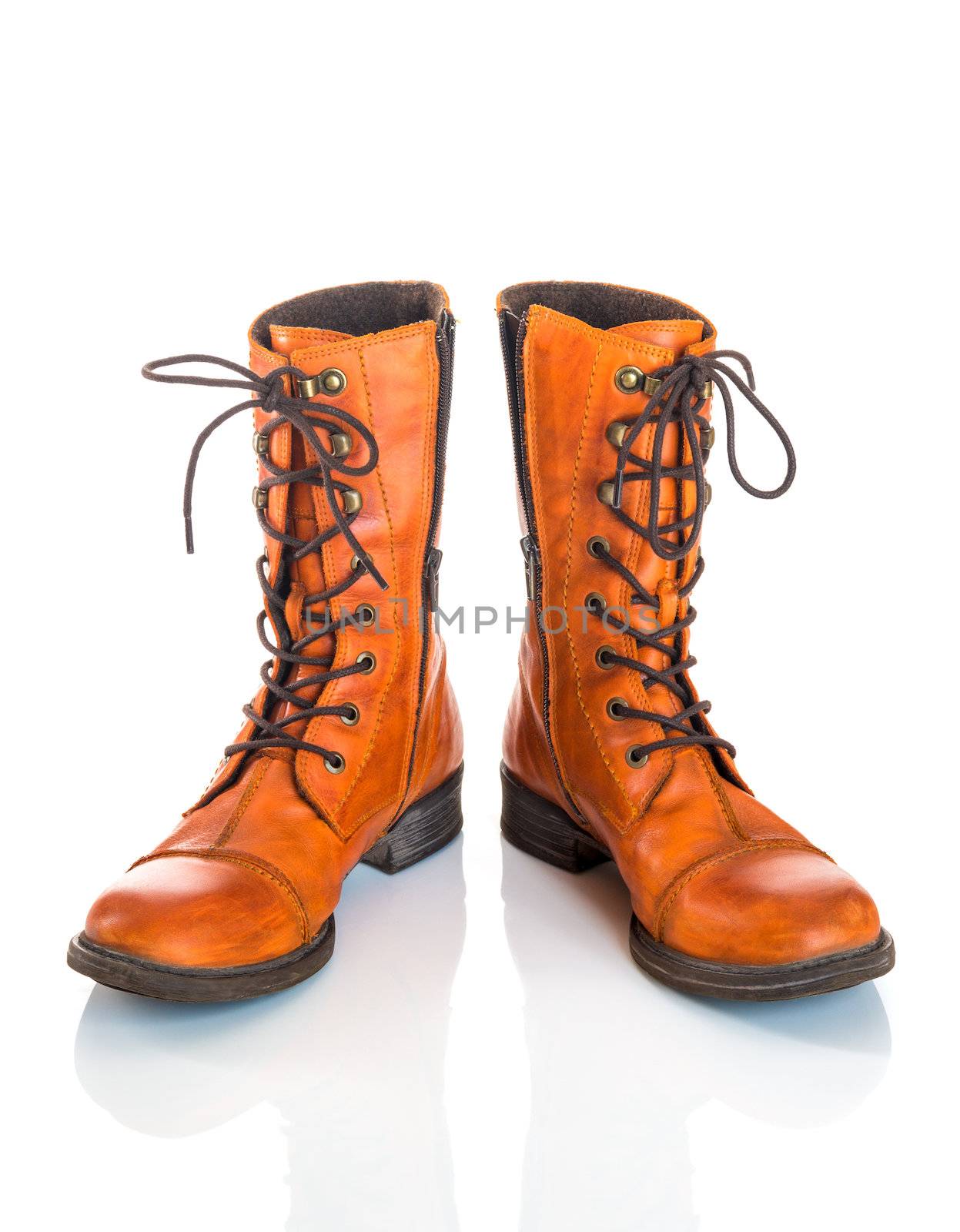 Orange leather boots, isolated on white background.
