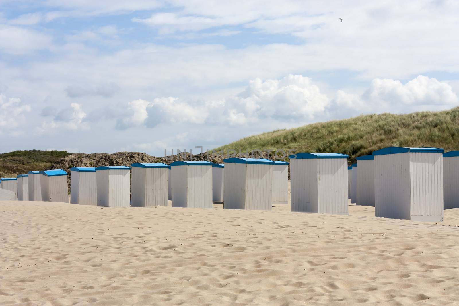 Beach huts along the North Sea in the Netherlands by Tetyana