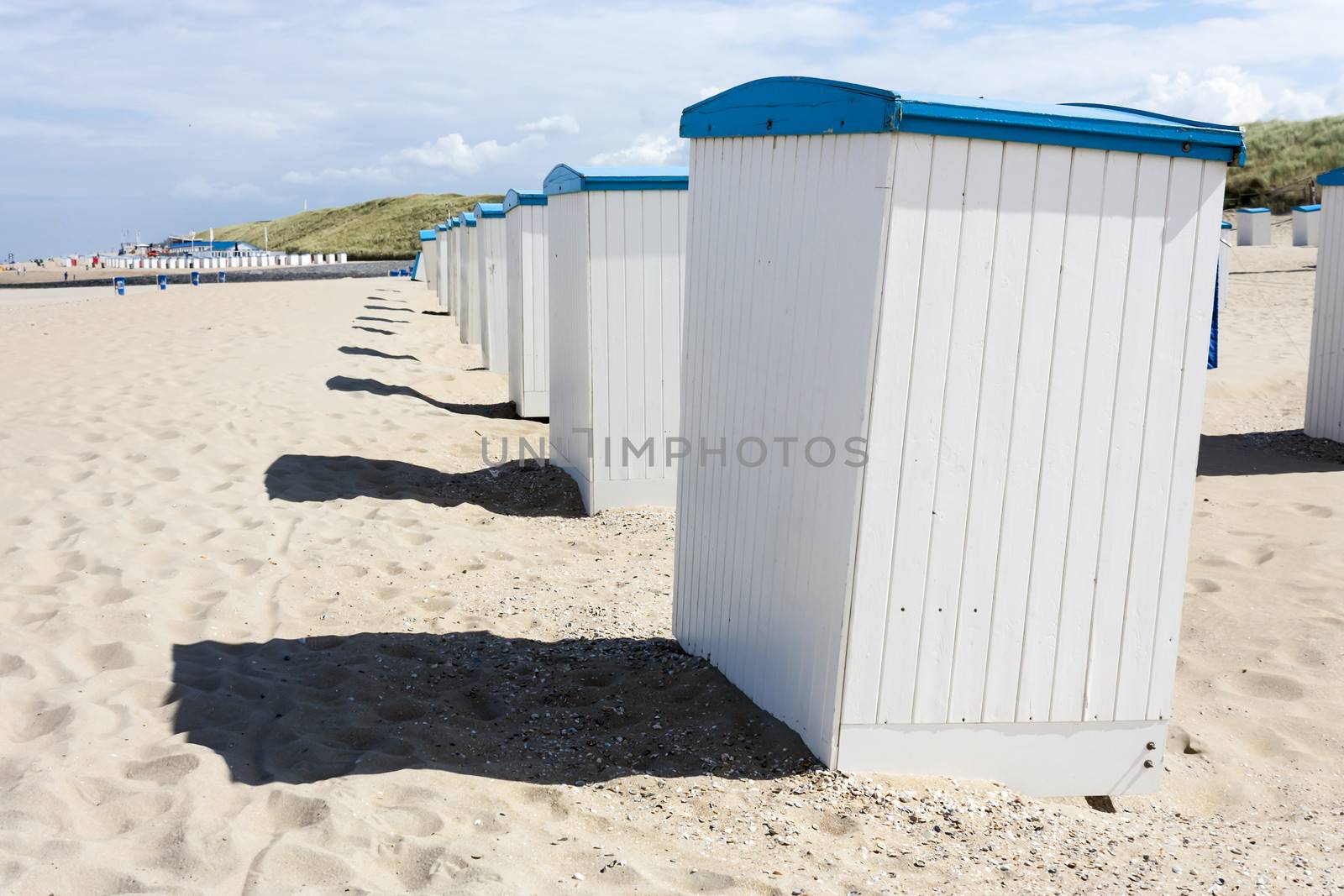 Beach huts along the North Sea in the Netherlands by Tetyana