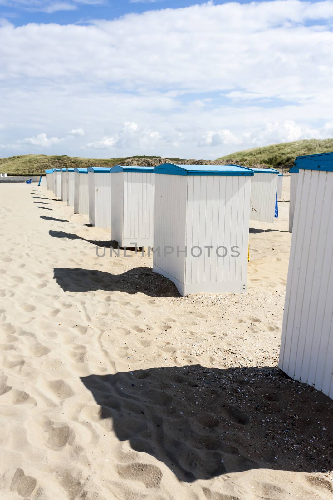 Beach huts along the North Sea in the Netherlands by Tetyana