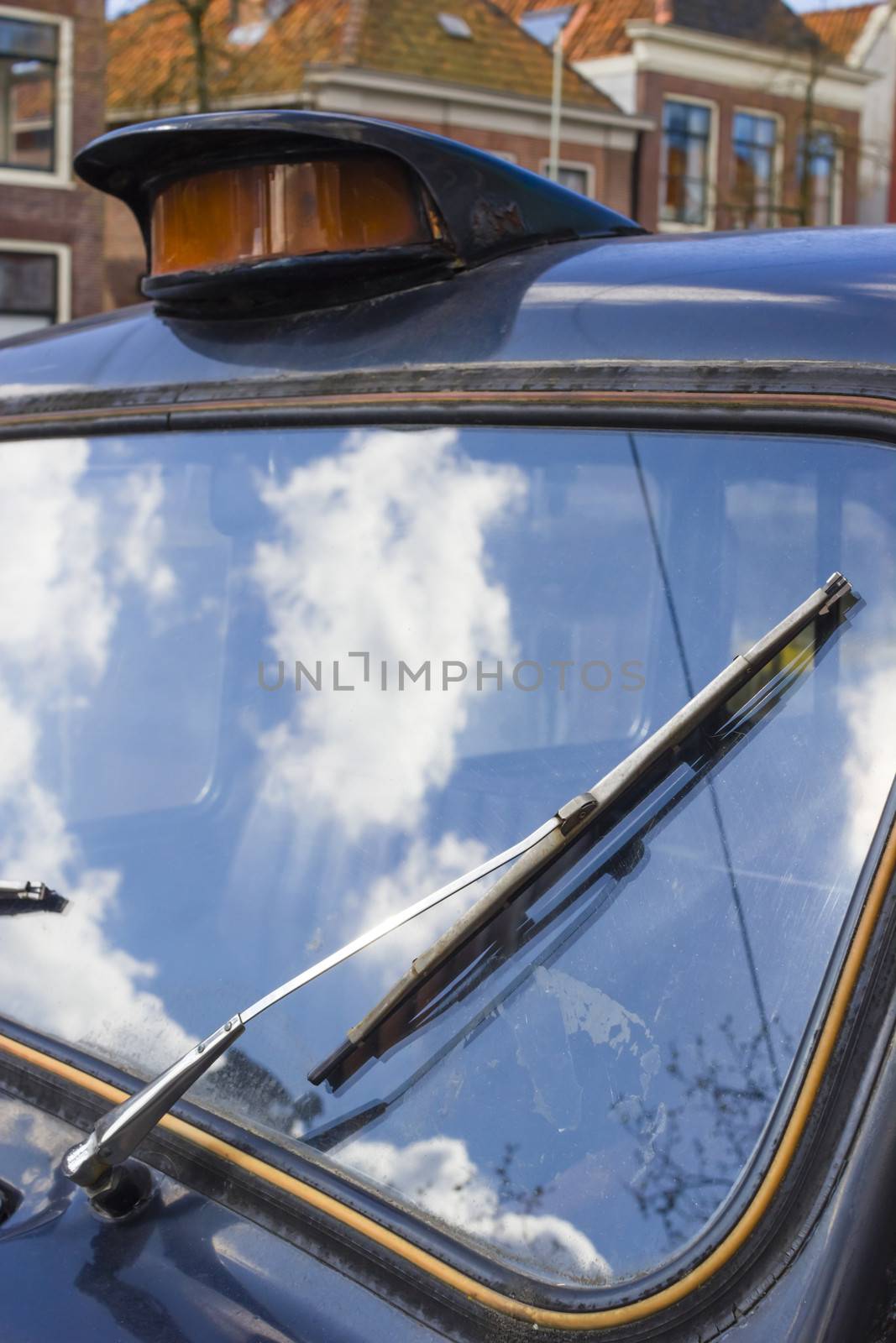 Vintage windshield wiper. Detail of windshield wiper on classic car.