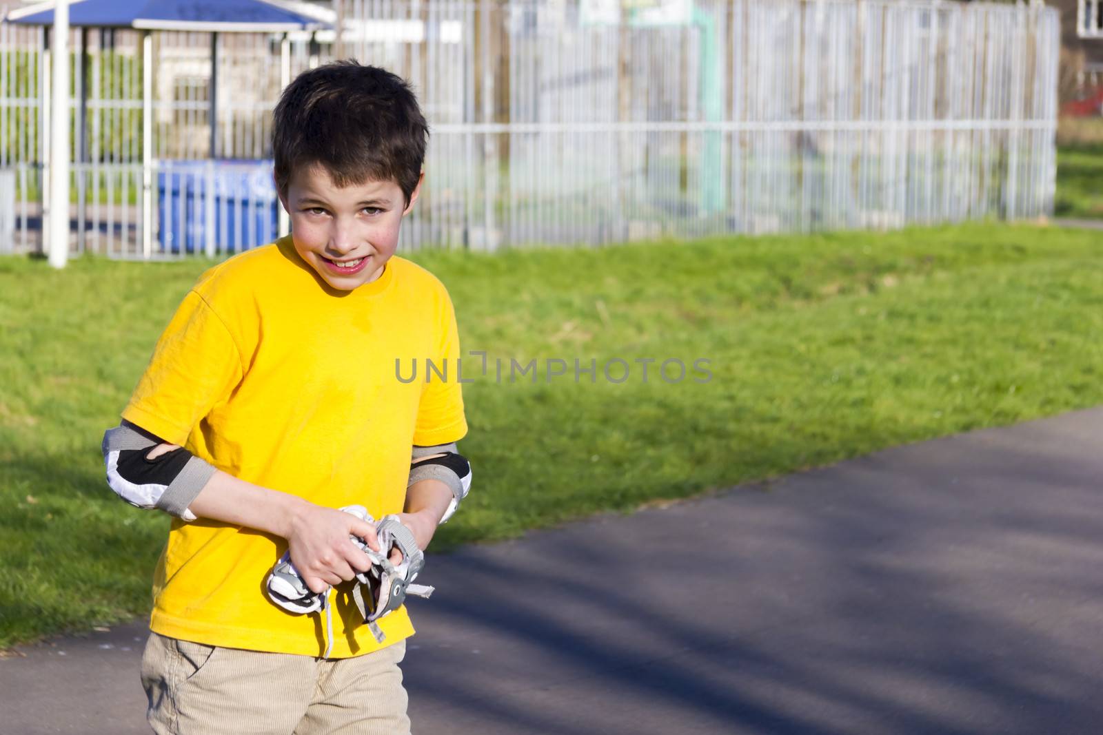 Shot of smiling rollerskaters in protection kit by Tetyana