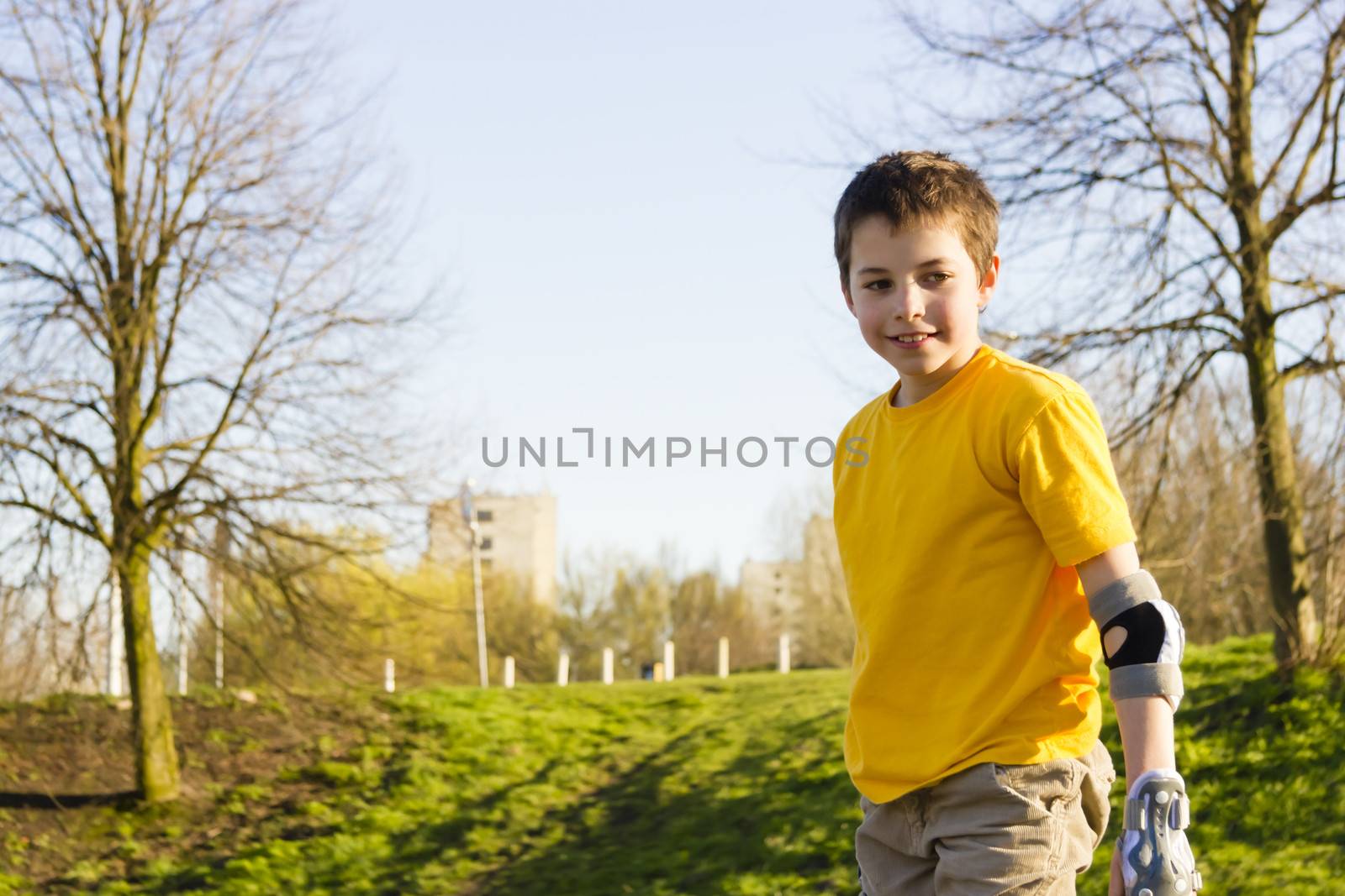 Shot of smiling sliding rollerskaters in protection kit