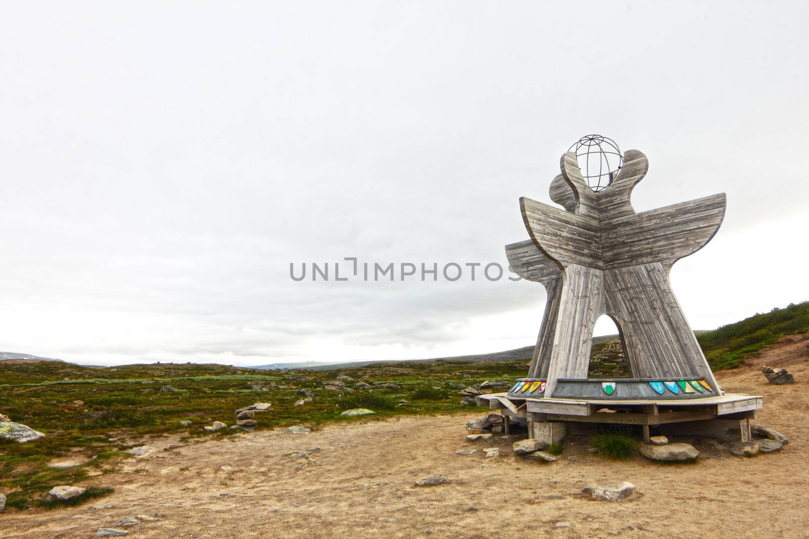 Arctic circle pint in Norway with wooden compass