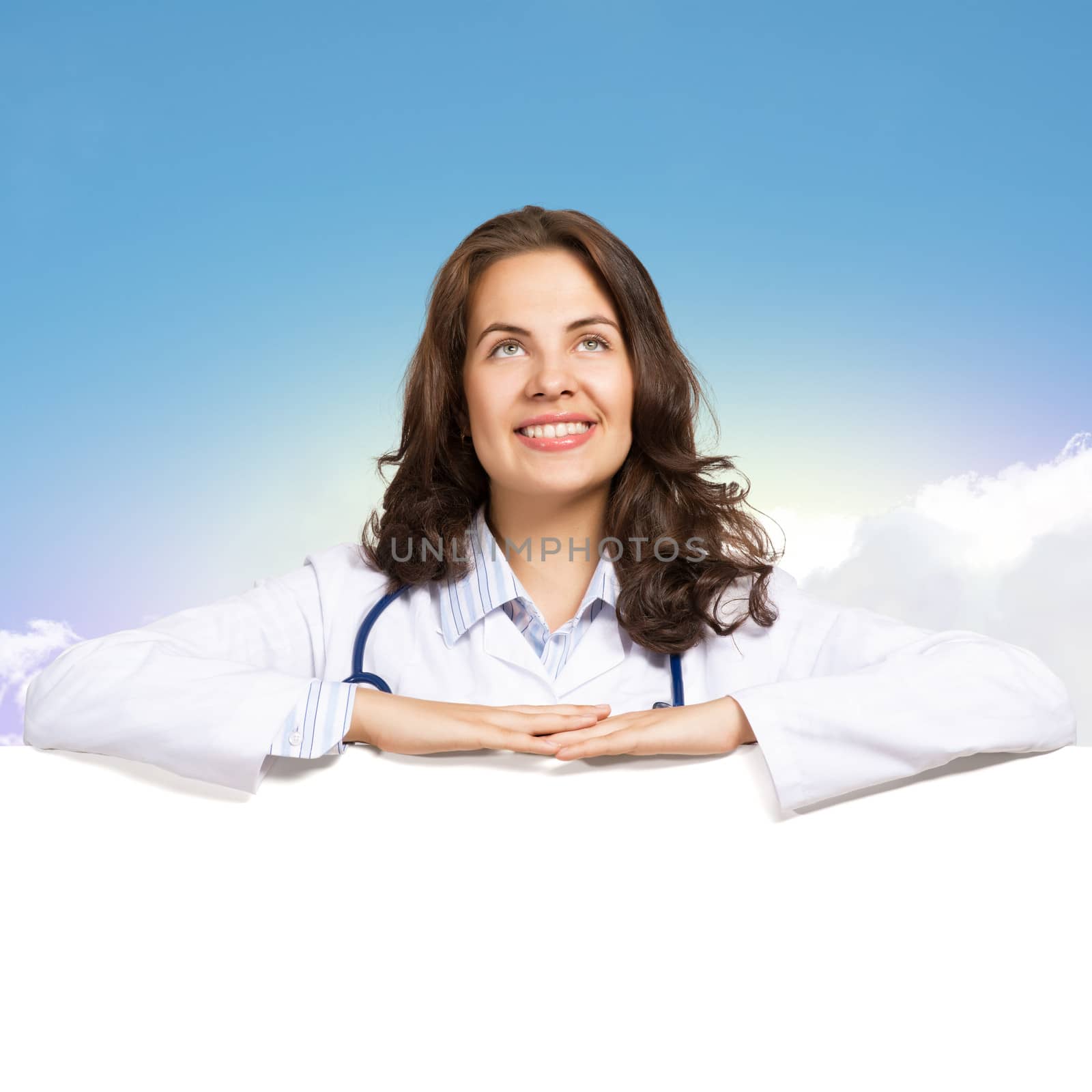 Young attractive female doctor put her hands on the blank banner, place for text