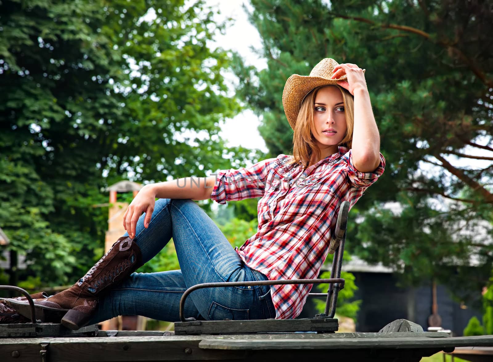 Sexy cowgirl. Young woman portrait in a hat