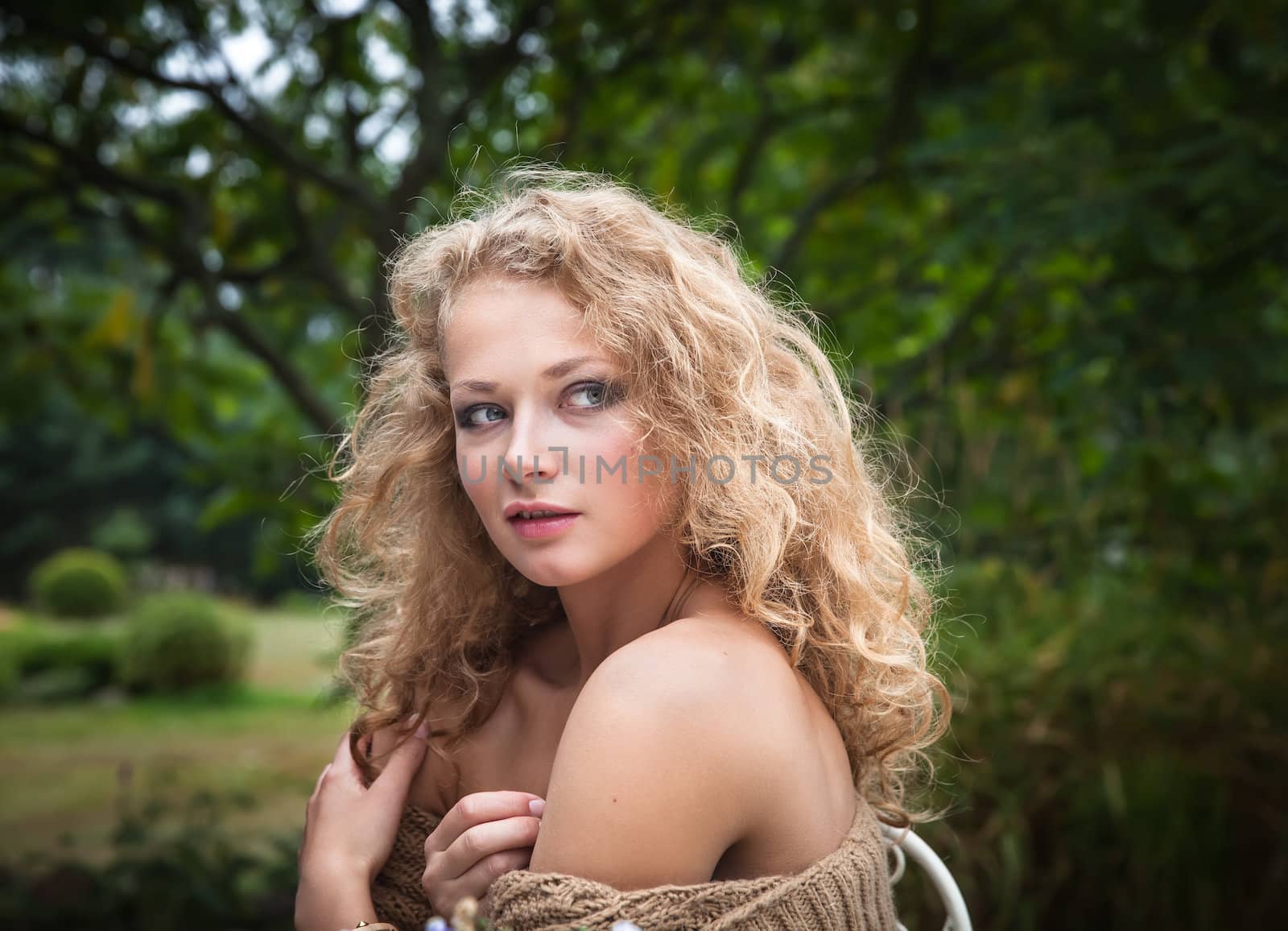 young beautiful woman is resting in the garden