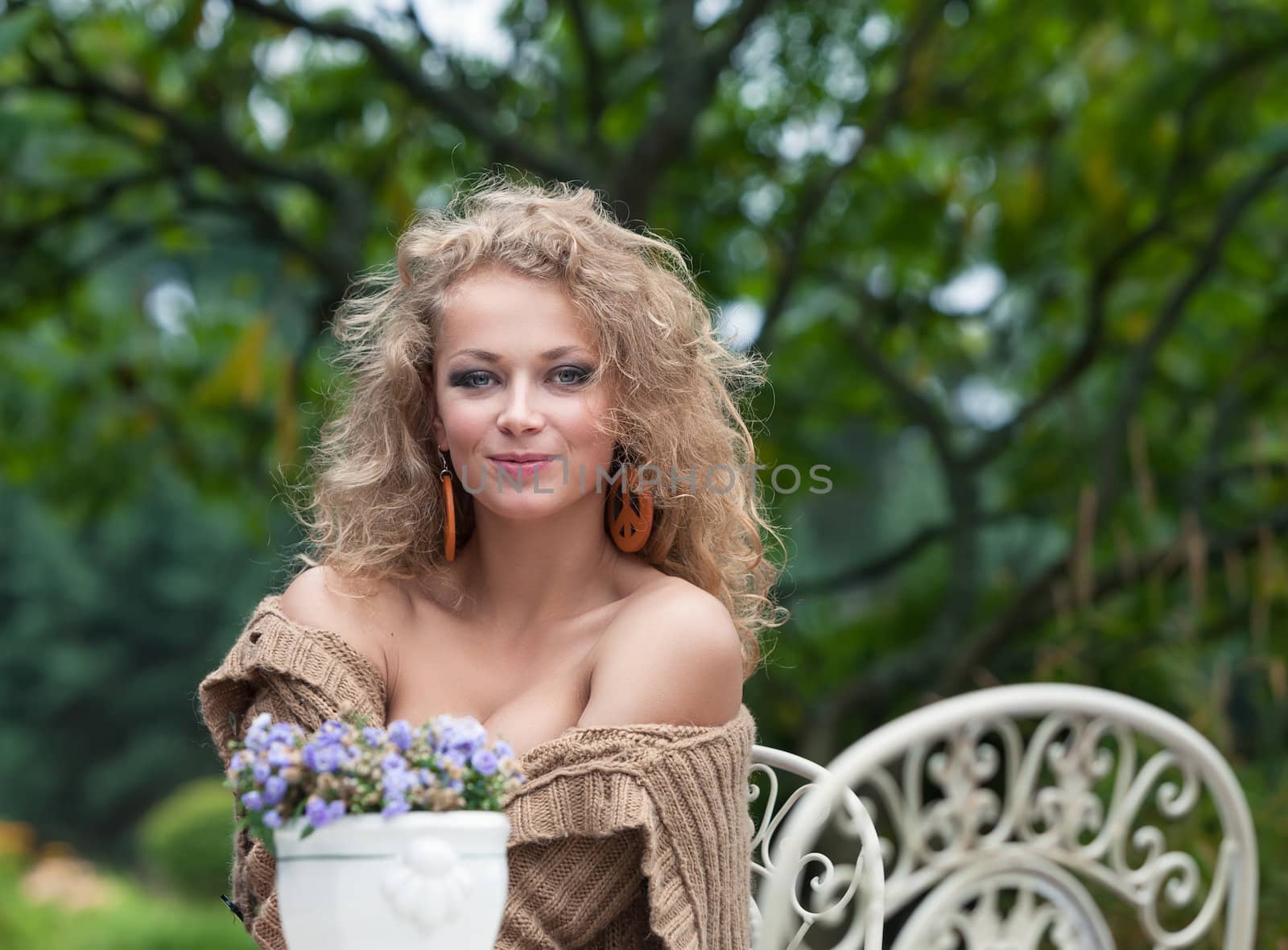 young beautiful woman is resting in the garden