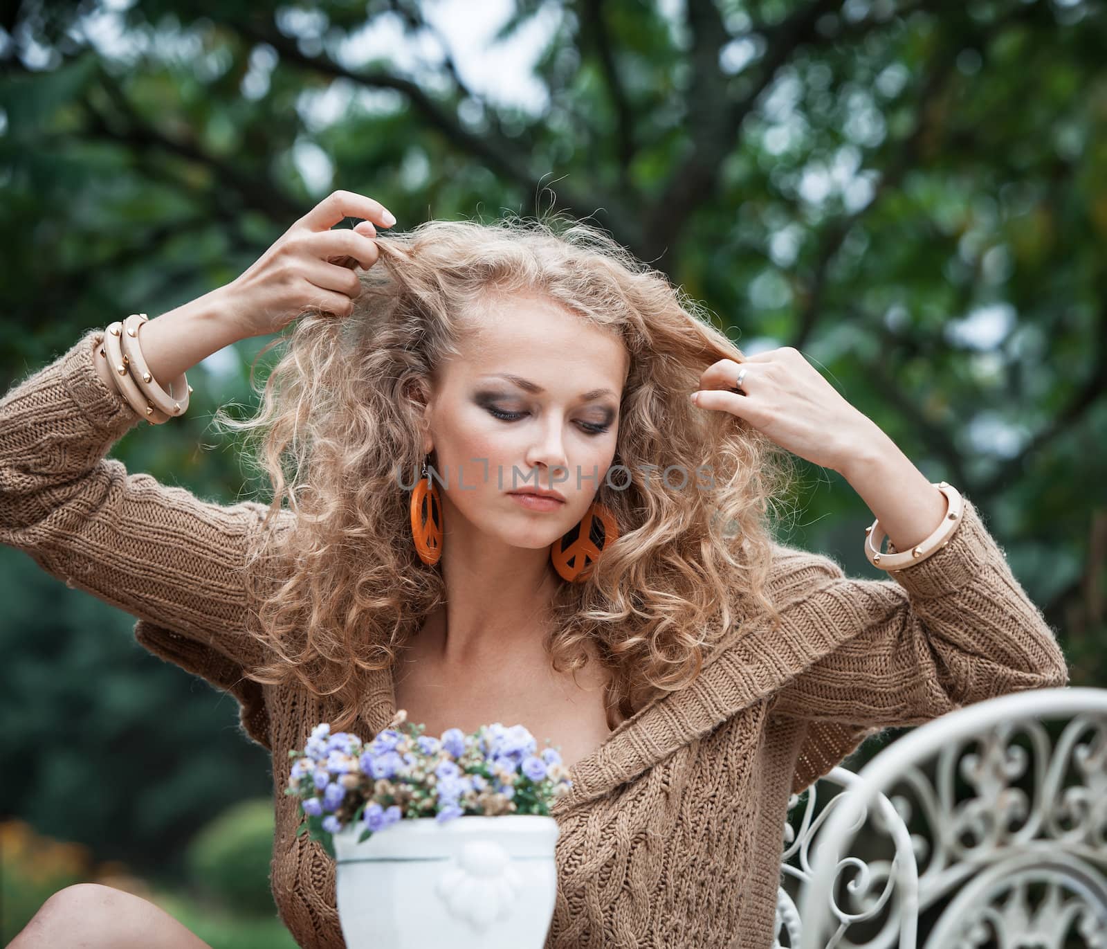 young beautiful woman is resting in the garden