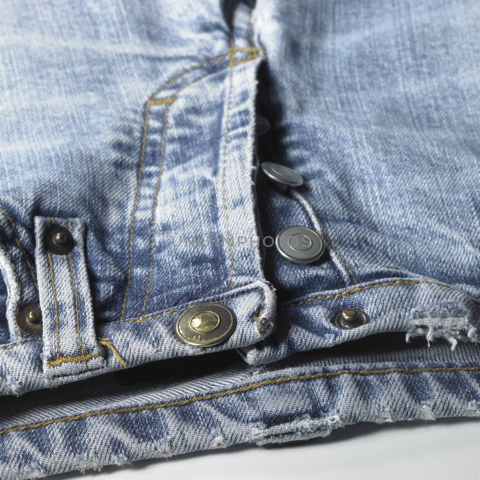 studio shot of a pair of jeans detail in white back, with clipping path