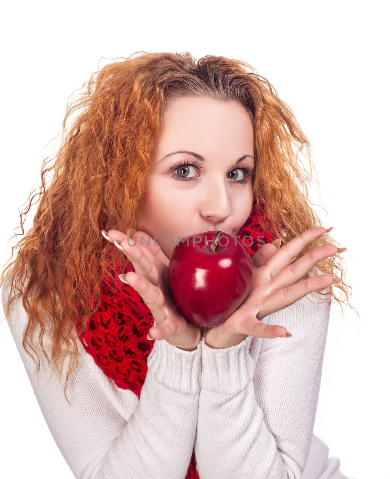 Red-haired girl with apple isolated on white