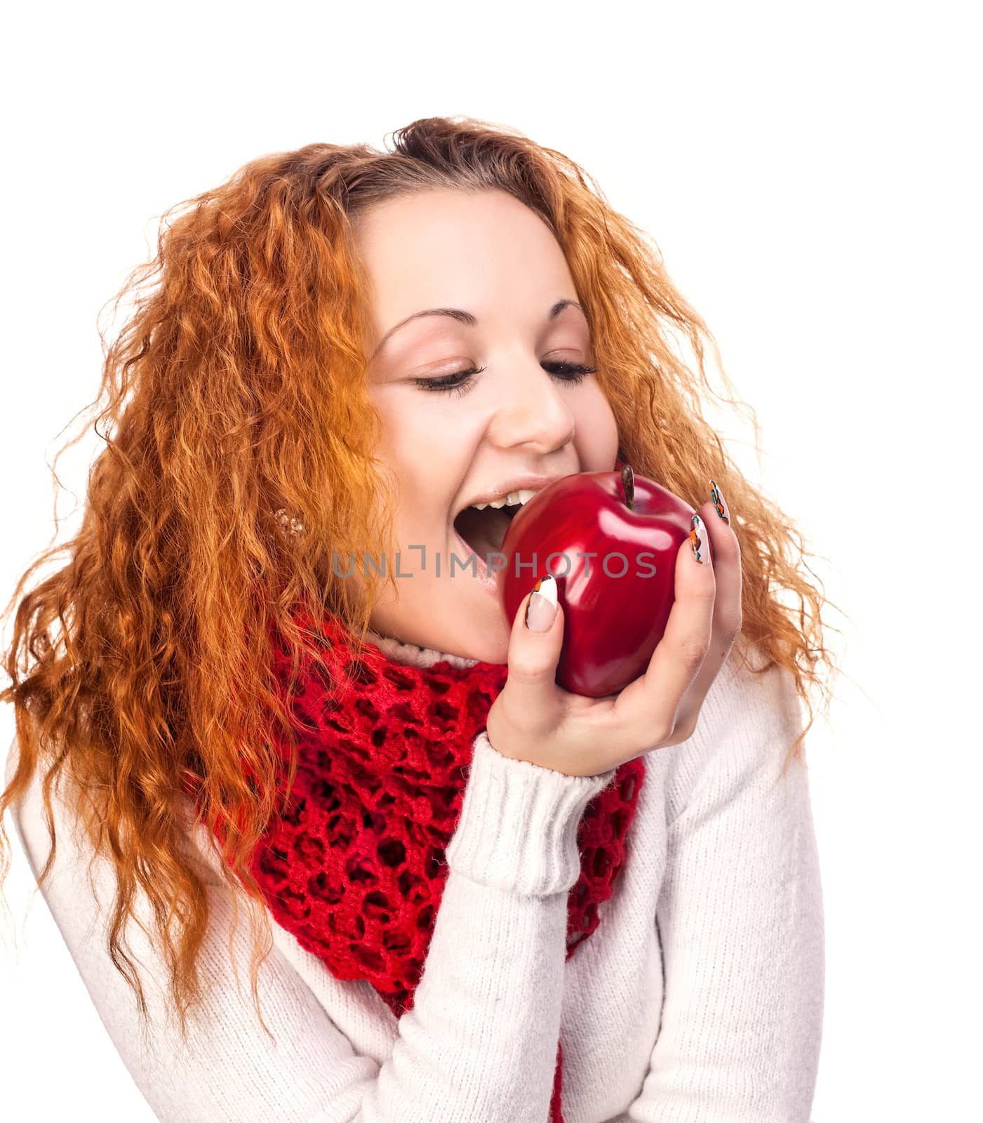 Red-haired girl with apple isolated on white