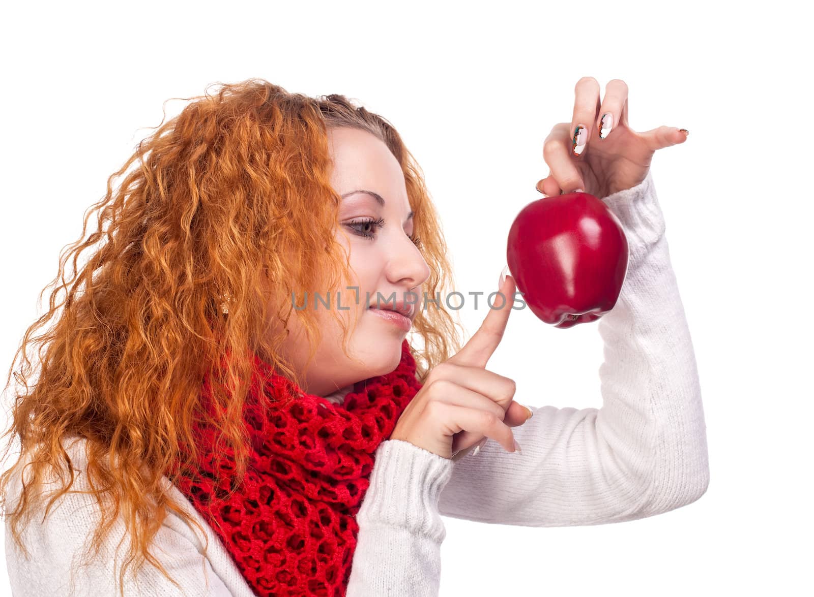 Red-haired girl with apple isolated on white