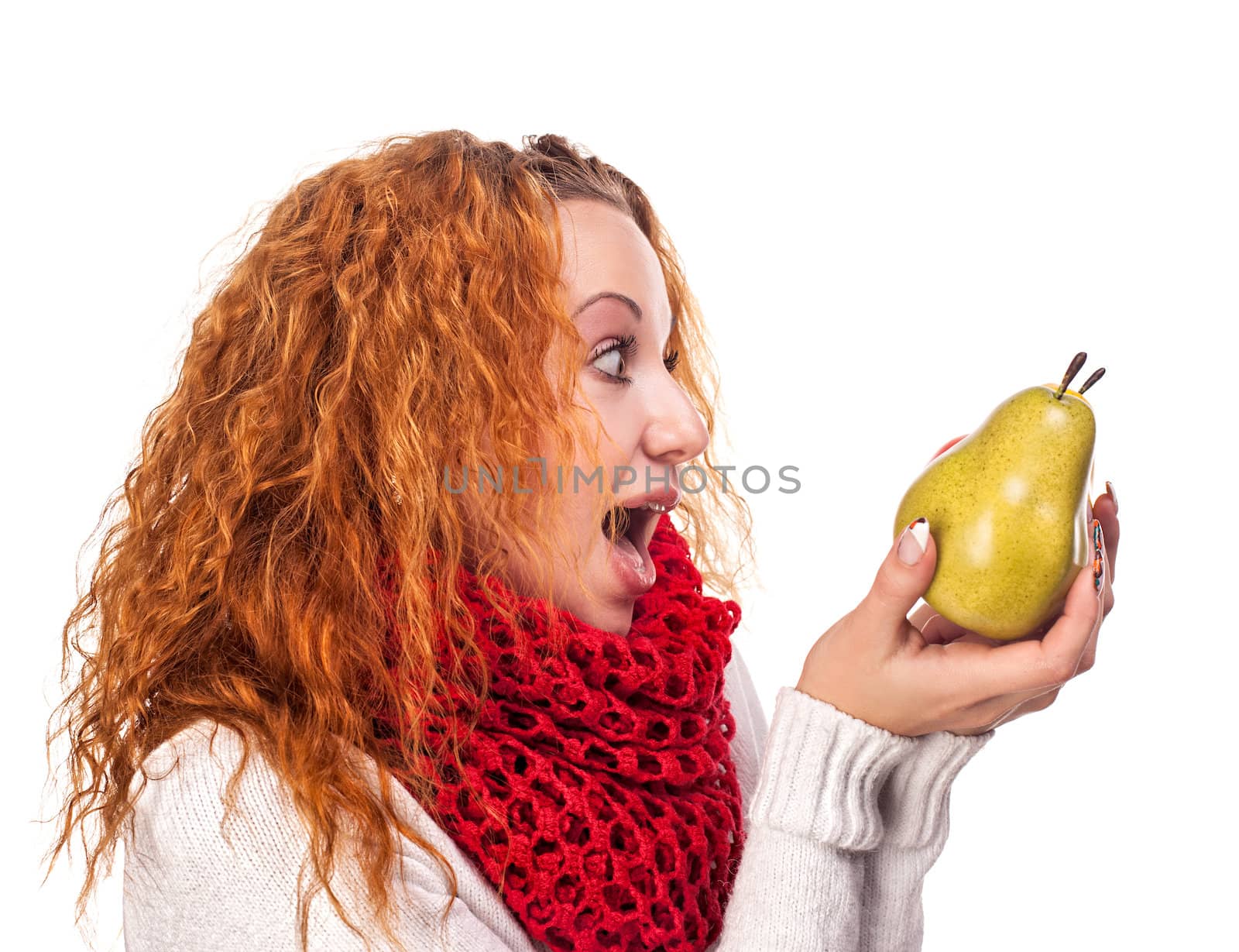 Surprised red-haired girl with a pears isolated on white