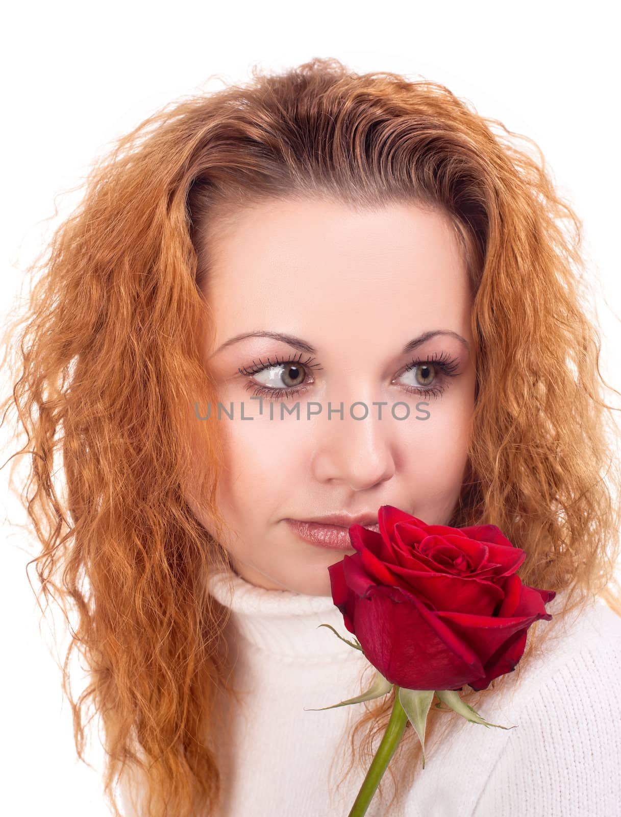 Portrait of young beautiful woman with red rose