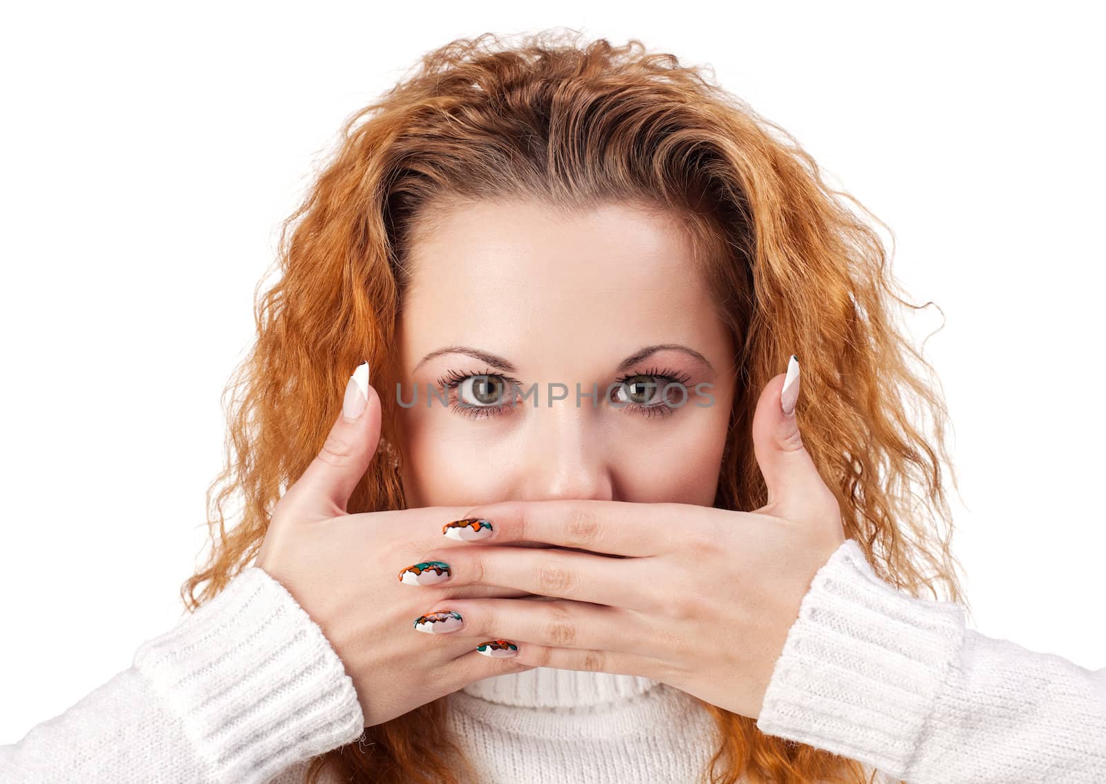 Portrait of red-haired woman covering her mouth by the hands, over white background