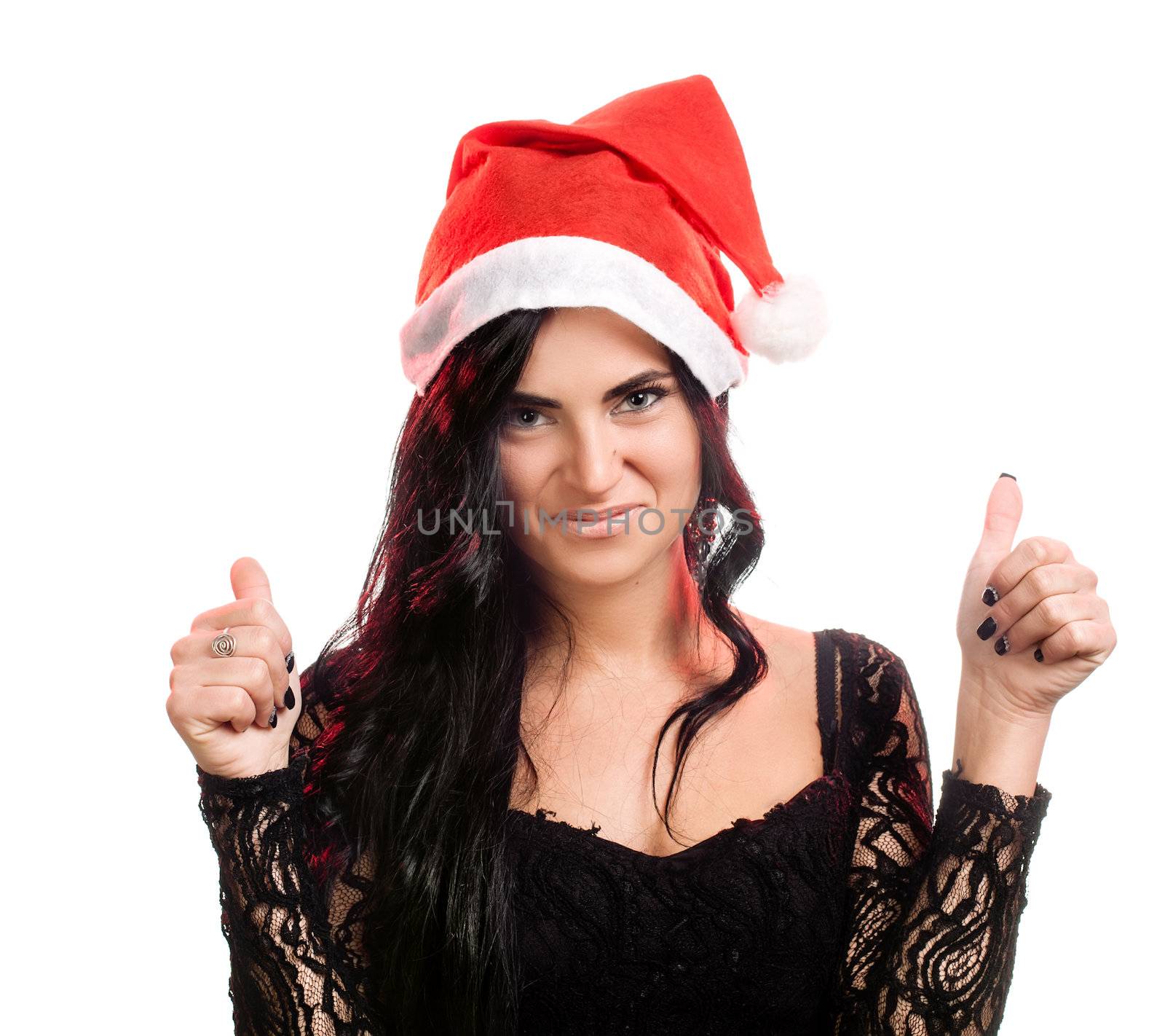 Portrait of joyful pretty woman in red santa claus hat with  tumbs up