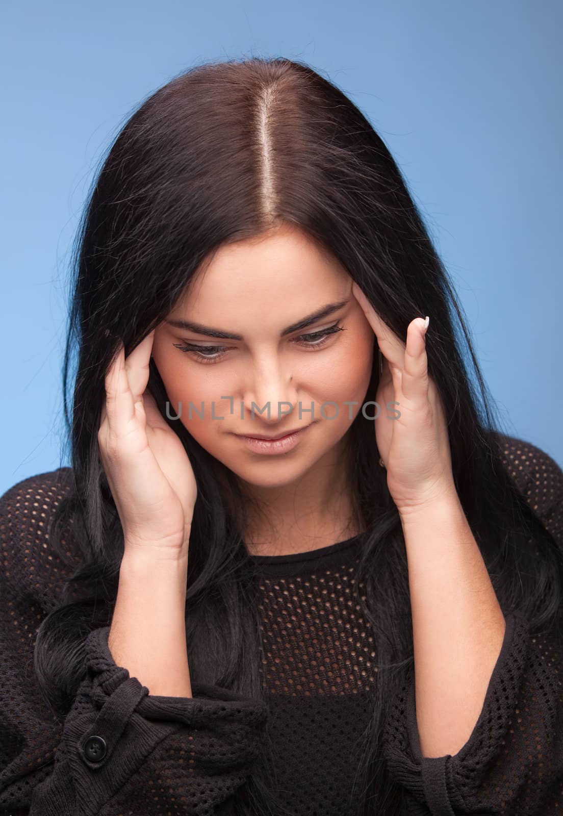 Unhappy young woman with bad headache