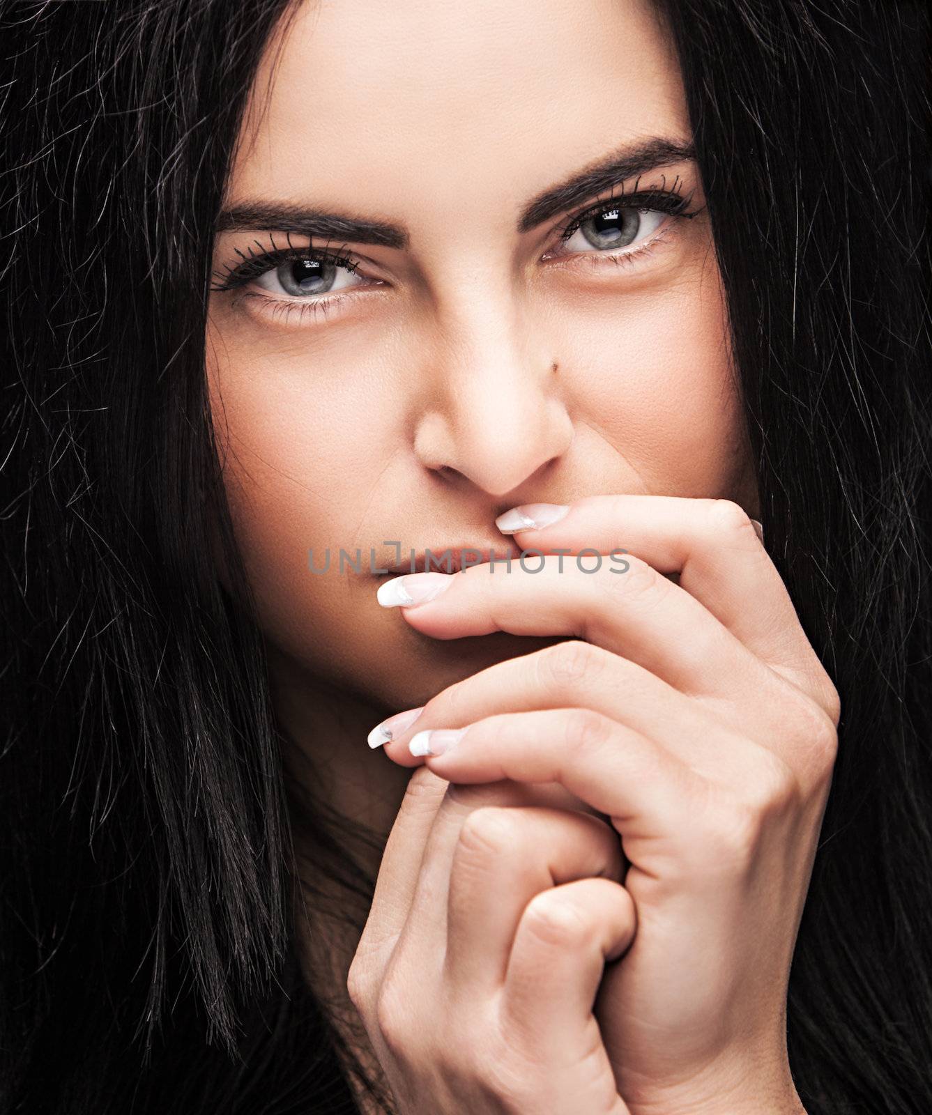 Pretty young brunette looking thoughtfully