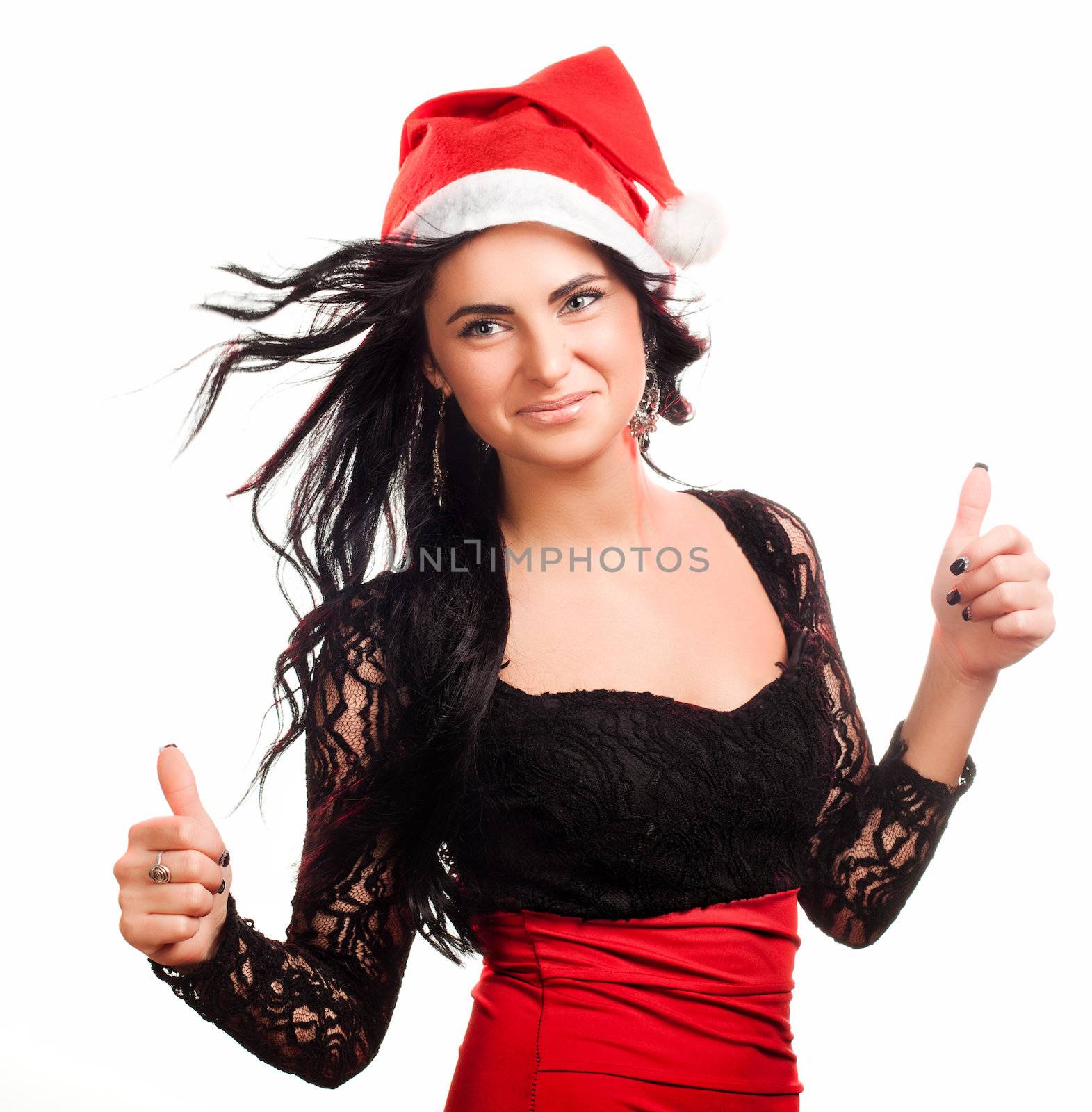 Portrait of joyful pretty woman in red santa claus hat