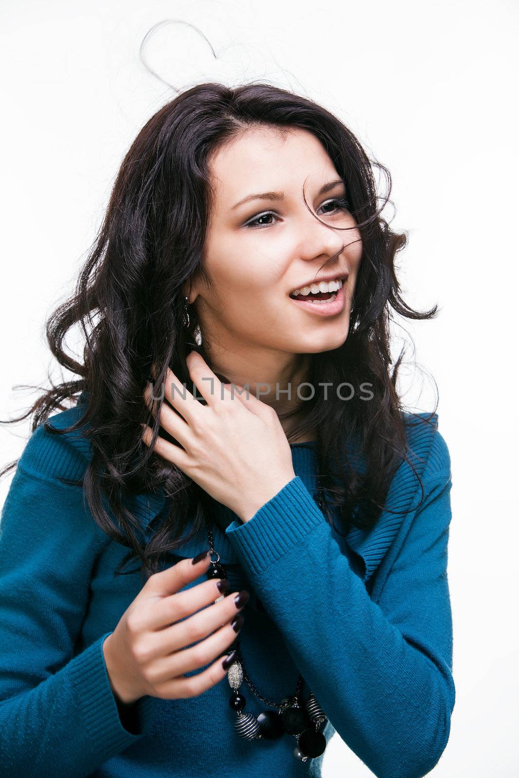 Portrait of a beautiful young woman with hair flying