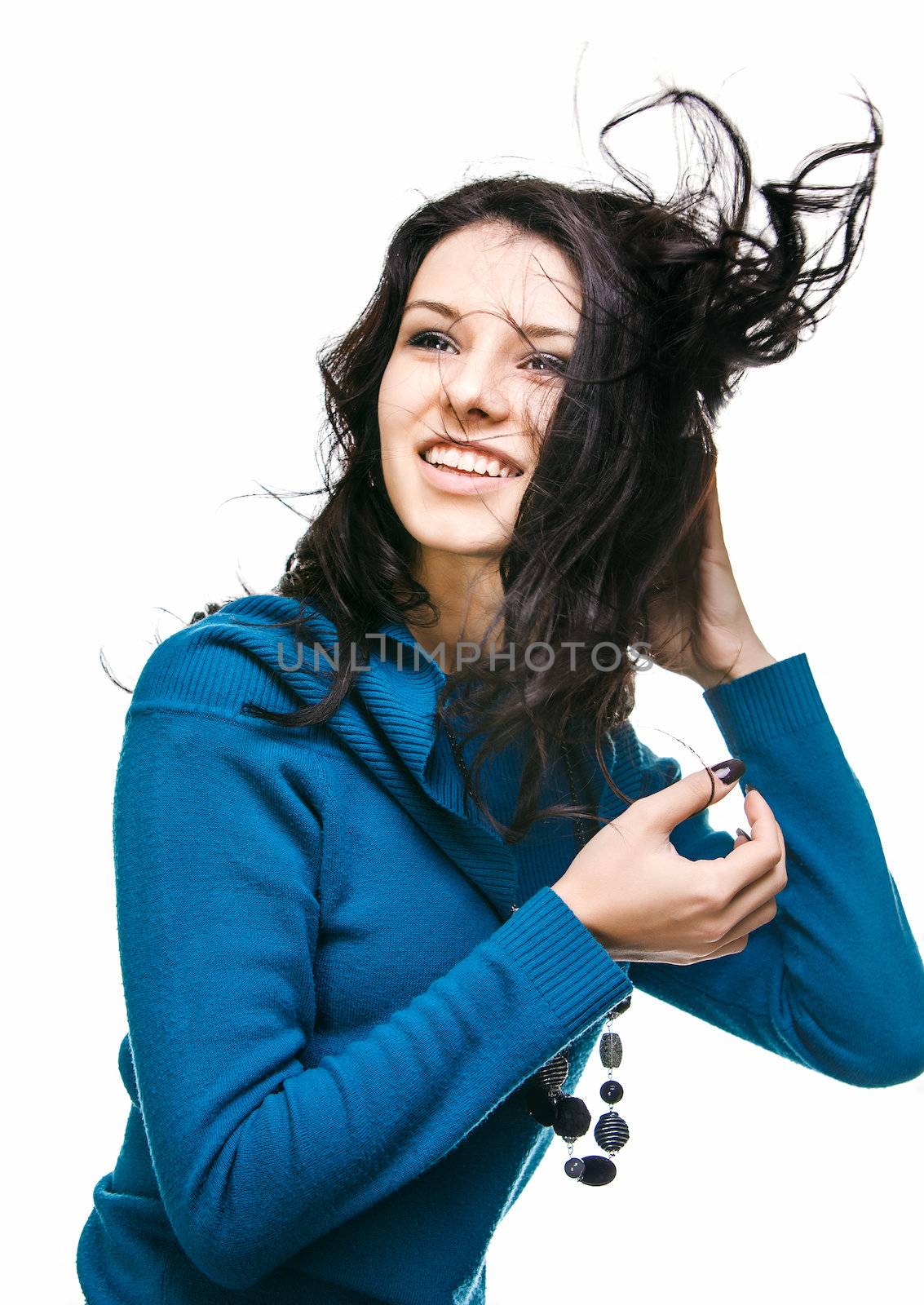 Portrait of a beautiful young woman with hair flying