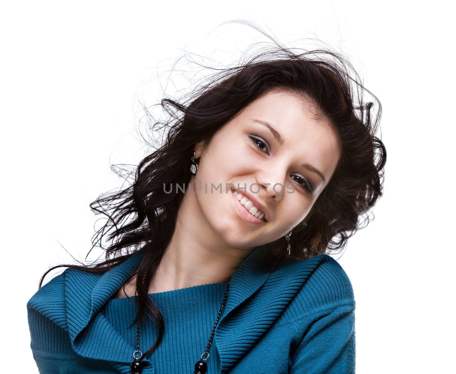 Portrait of a beautiful young woman with hair flying