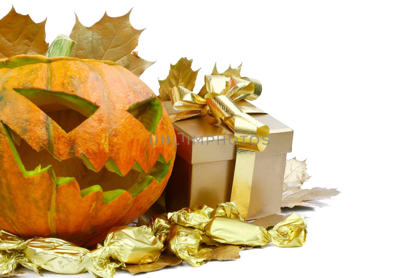 Halloween pumpkin with autumn leafs and gift isolated on white