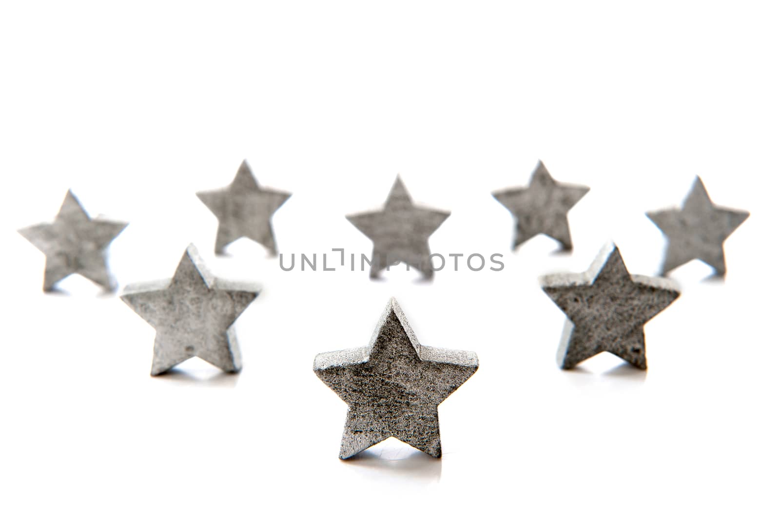 silver stars for christmas in a row on a white background