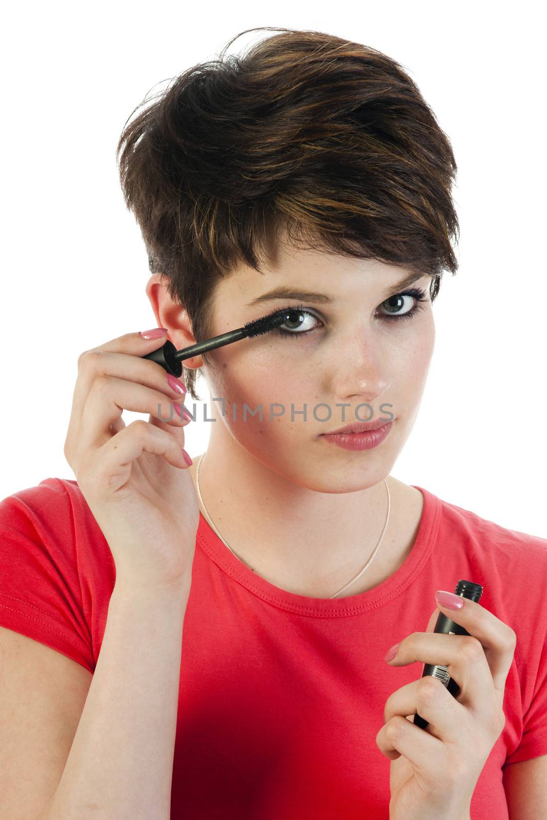 close up of a women face with a mascara brush