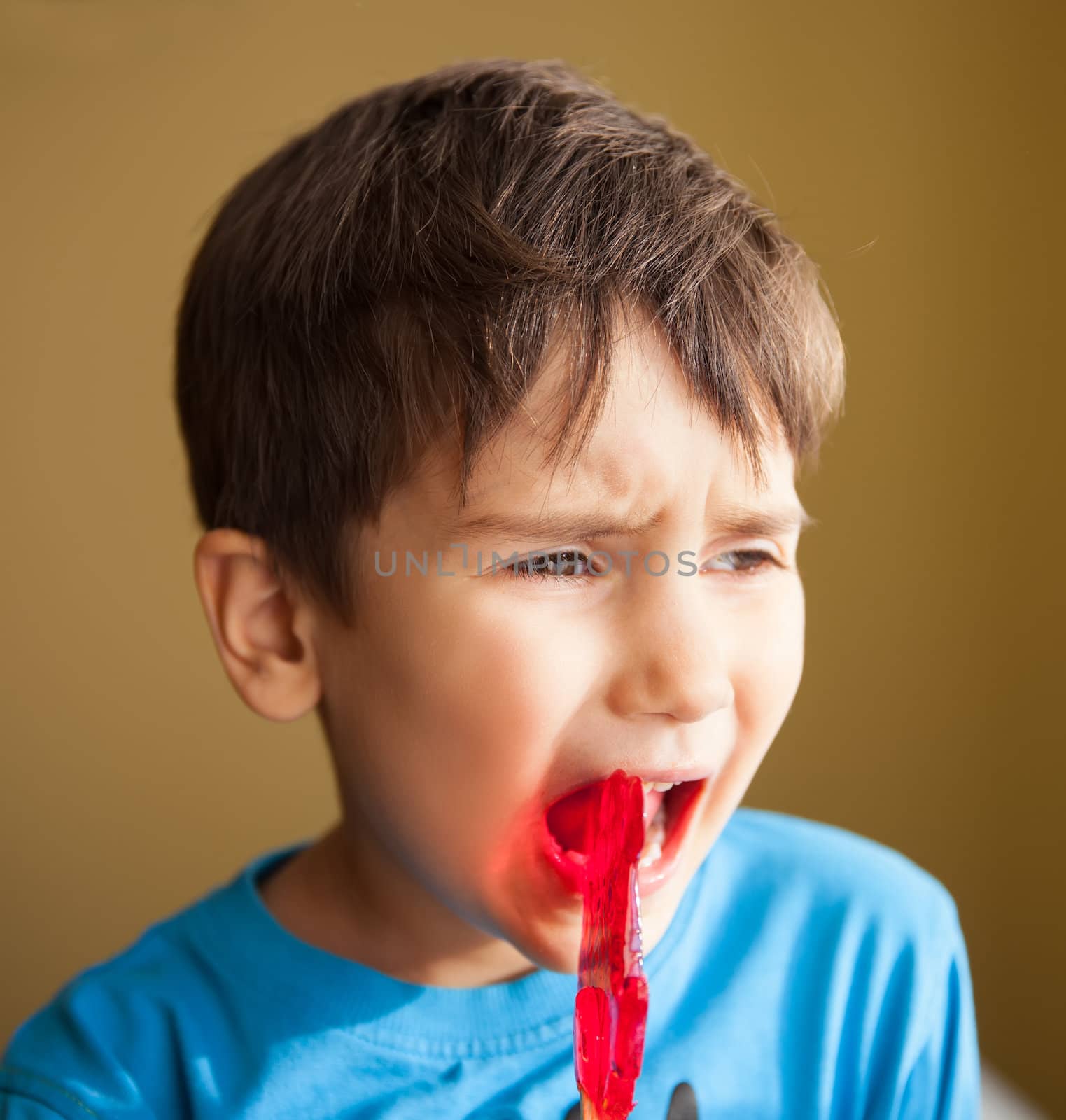 Close Up of Young Boy Eating A Lollipop