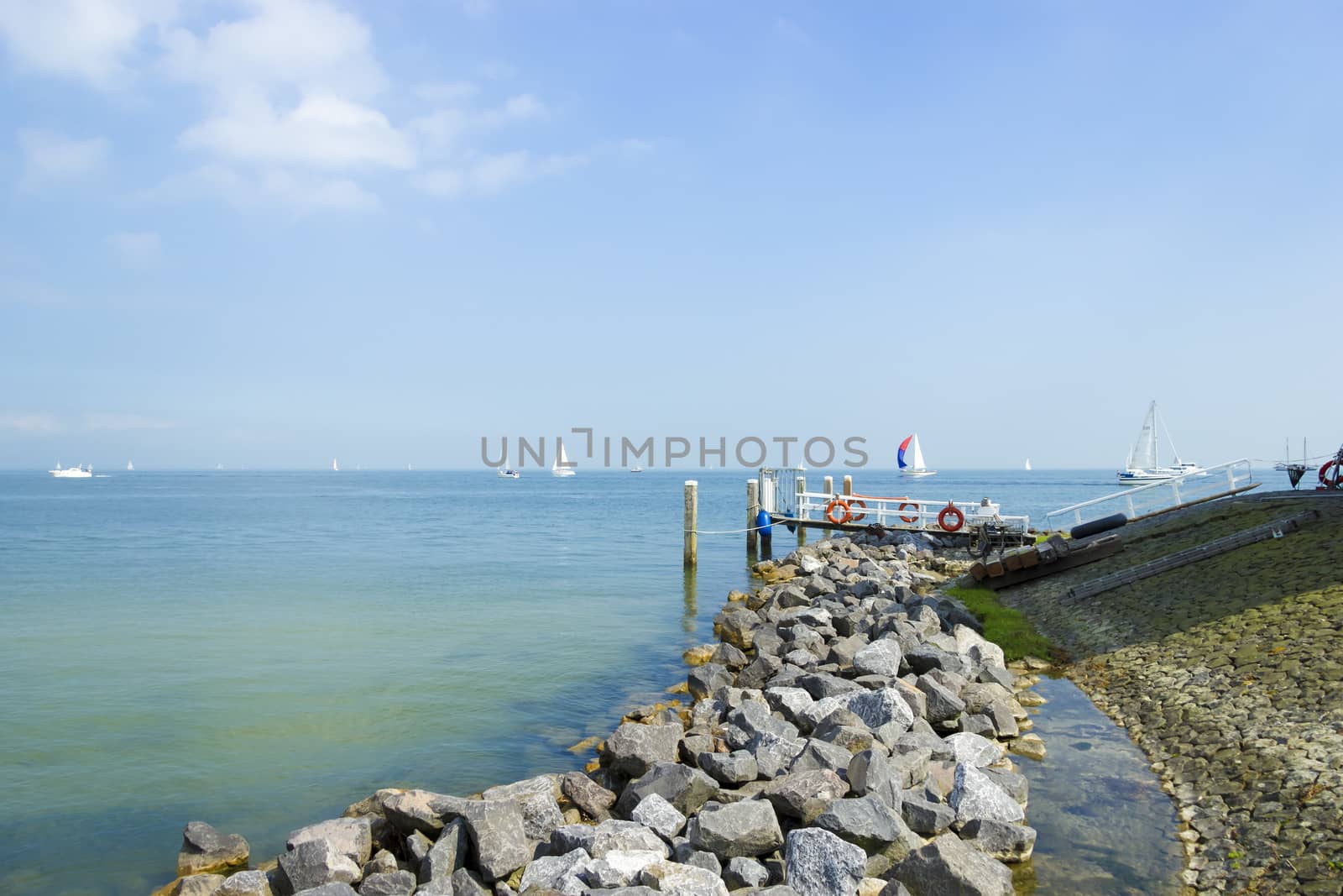 pier near Marken lighthouse, sunny day by Tetyana