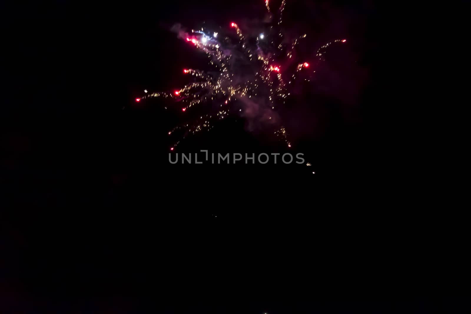Beautiful fireworks on the black sky background by Tetyana