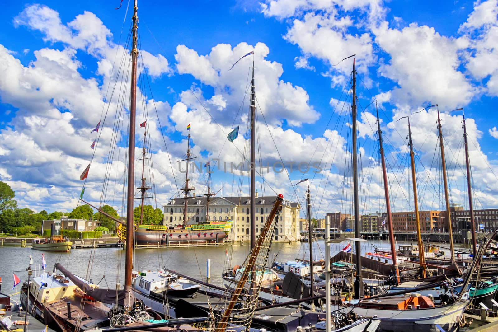 many ships parked near the shore in Amsterdam