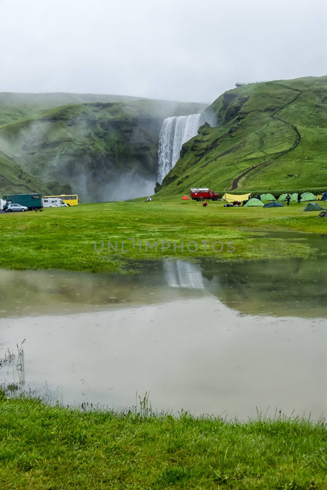 tent camp near Skogarfoss waterfall in Iceland, summer