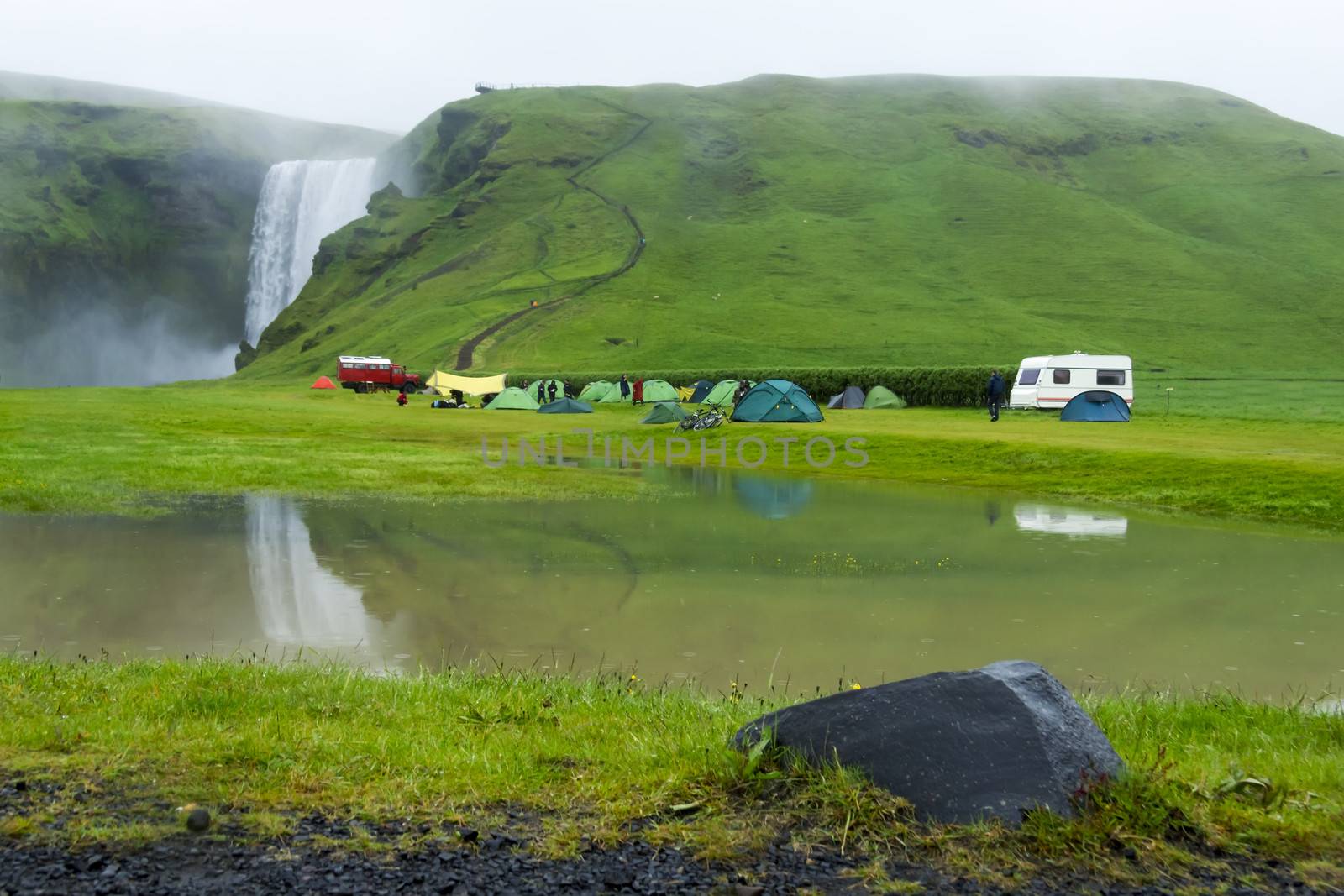 tent camp near Skogarfoss waterfall in Iceland, summer