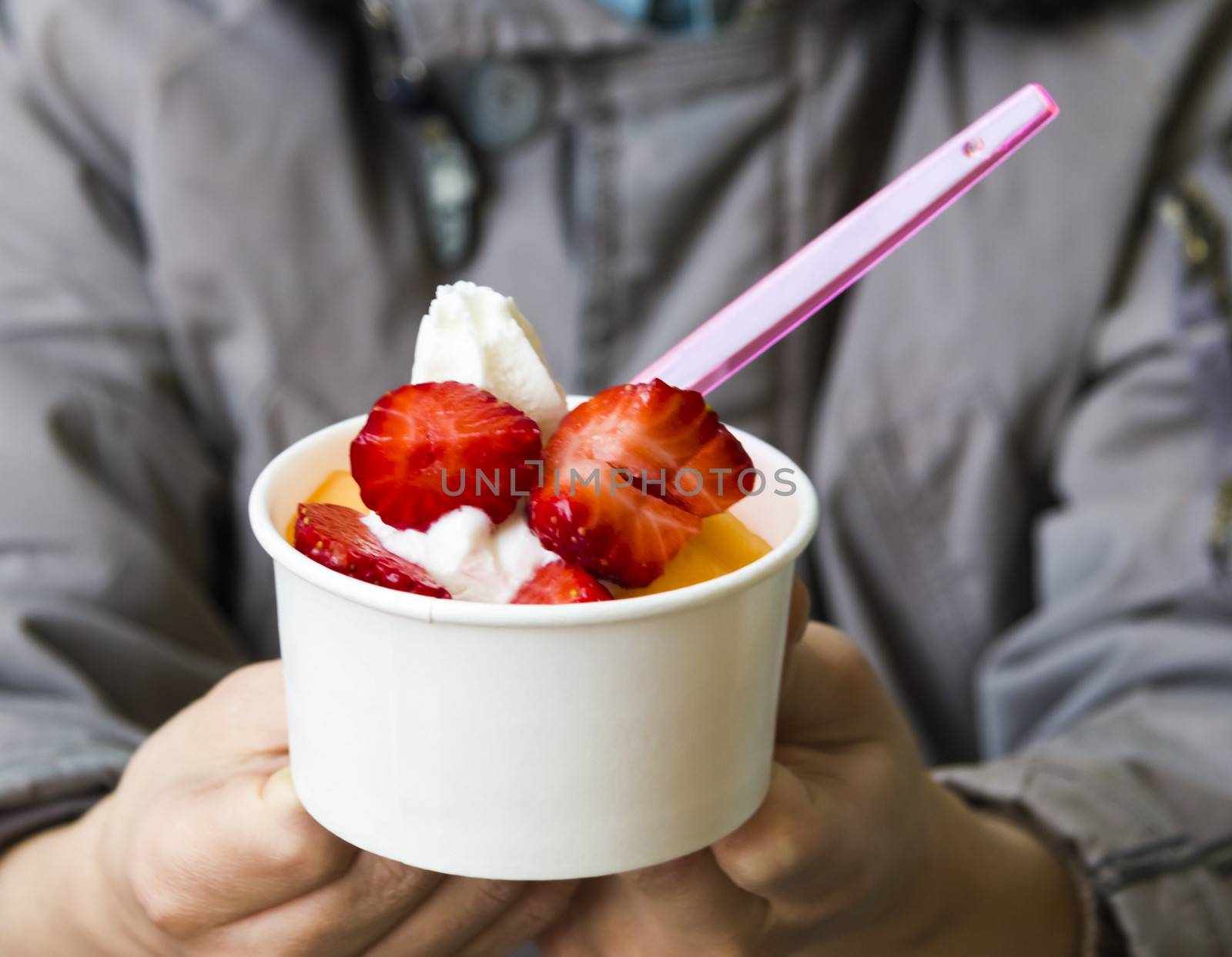 boy offers ice cream(strawberry topping) by Tetyana