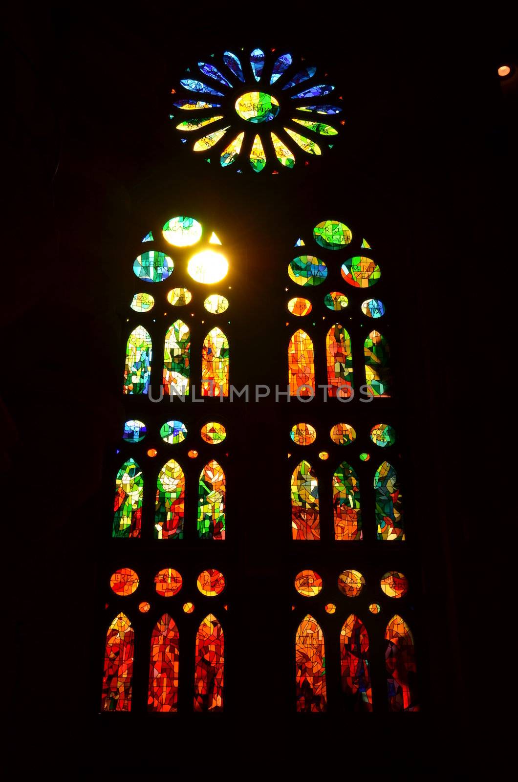 Beautiful arched stained glass window in the Sagrada Familia Cathedral,Barcelona.