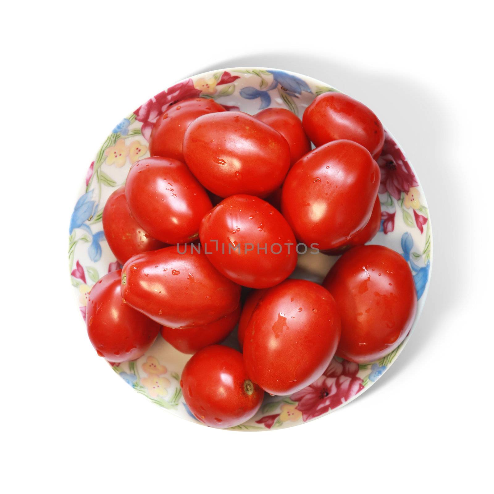 tomatoes on plate by ssuaphoto